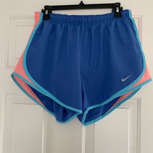 Blue Nike running shorts